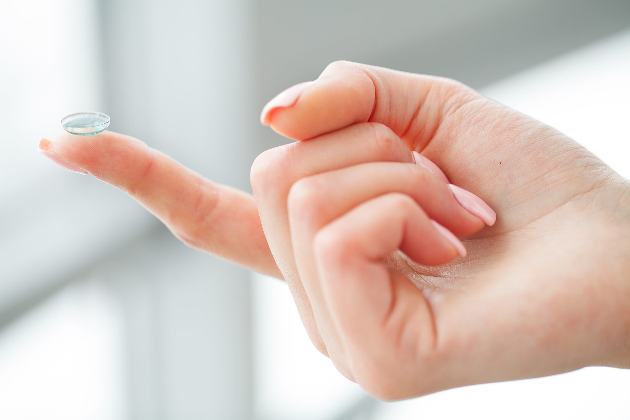 contact lens on finger